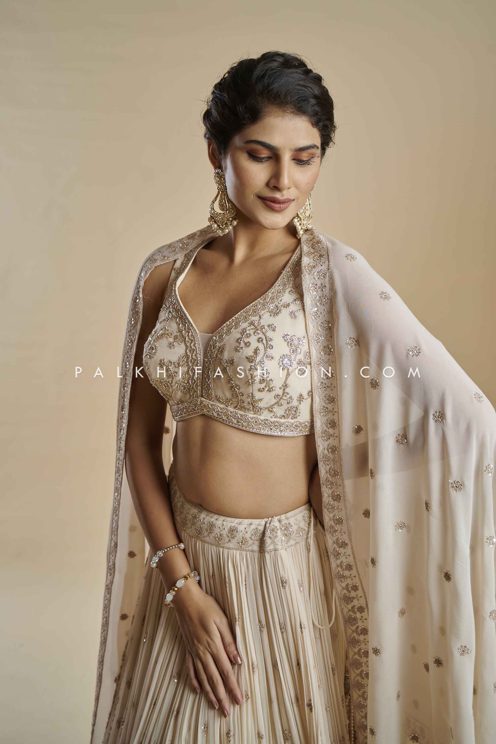 Imperial Charm: Exclusive Champagne Lehenga Choli with Handwork