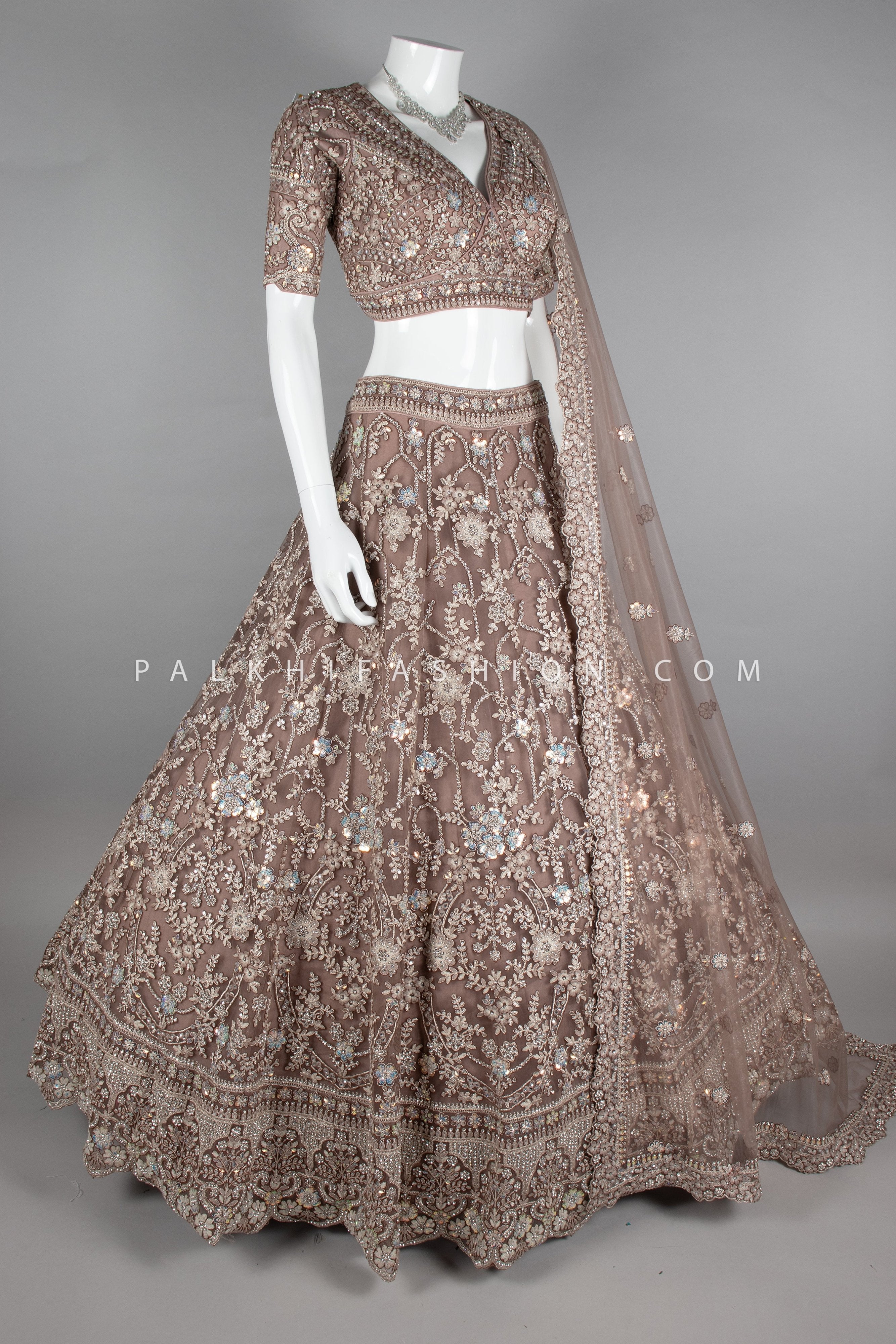 Graceful Grandeur: Soft Amber Lehenga Choli with Embroidery & Handwork