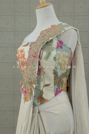 Enchanted Bloom: Ivory Pre - Draped Saree with Floral Embroidered Corset – Palkhi Fashion