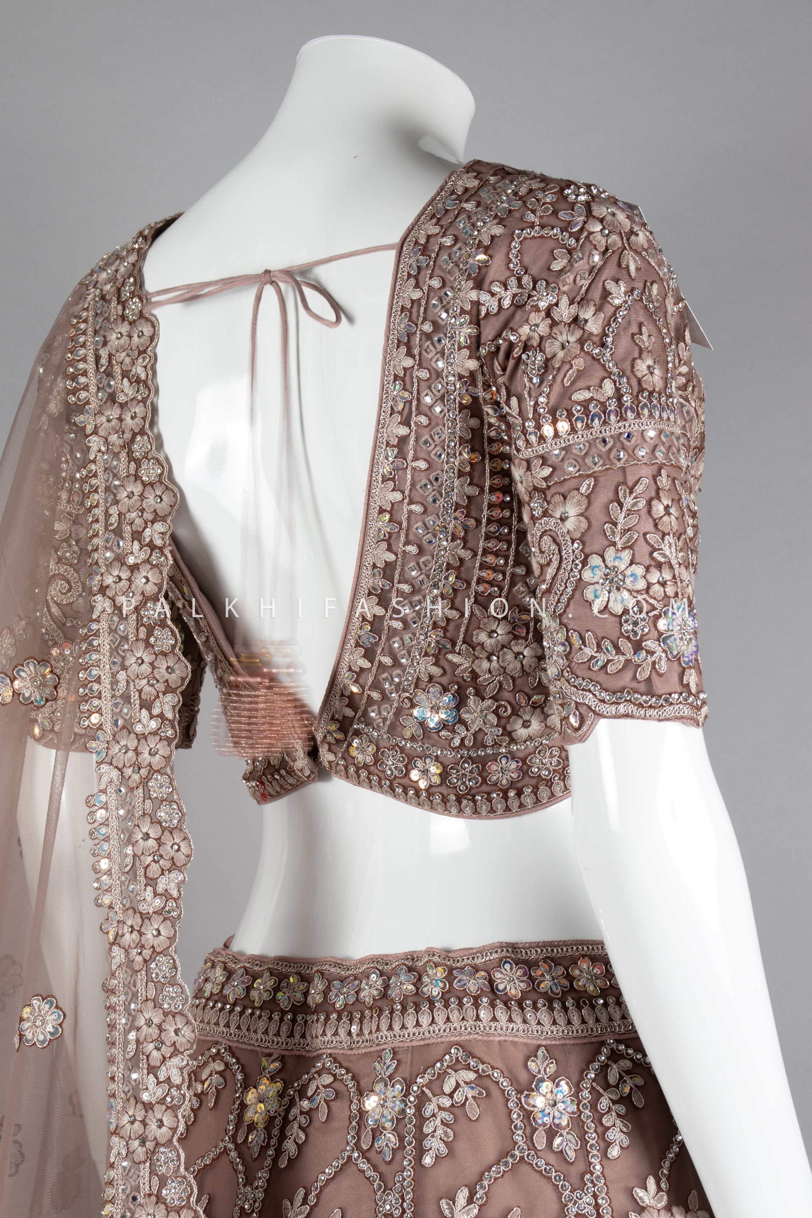 Graceful Grandeur: Soft Amber Lehenga Choli with Embroidery & Handwork