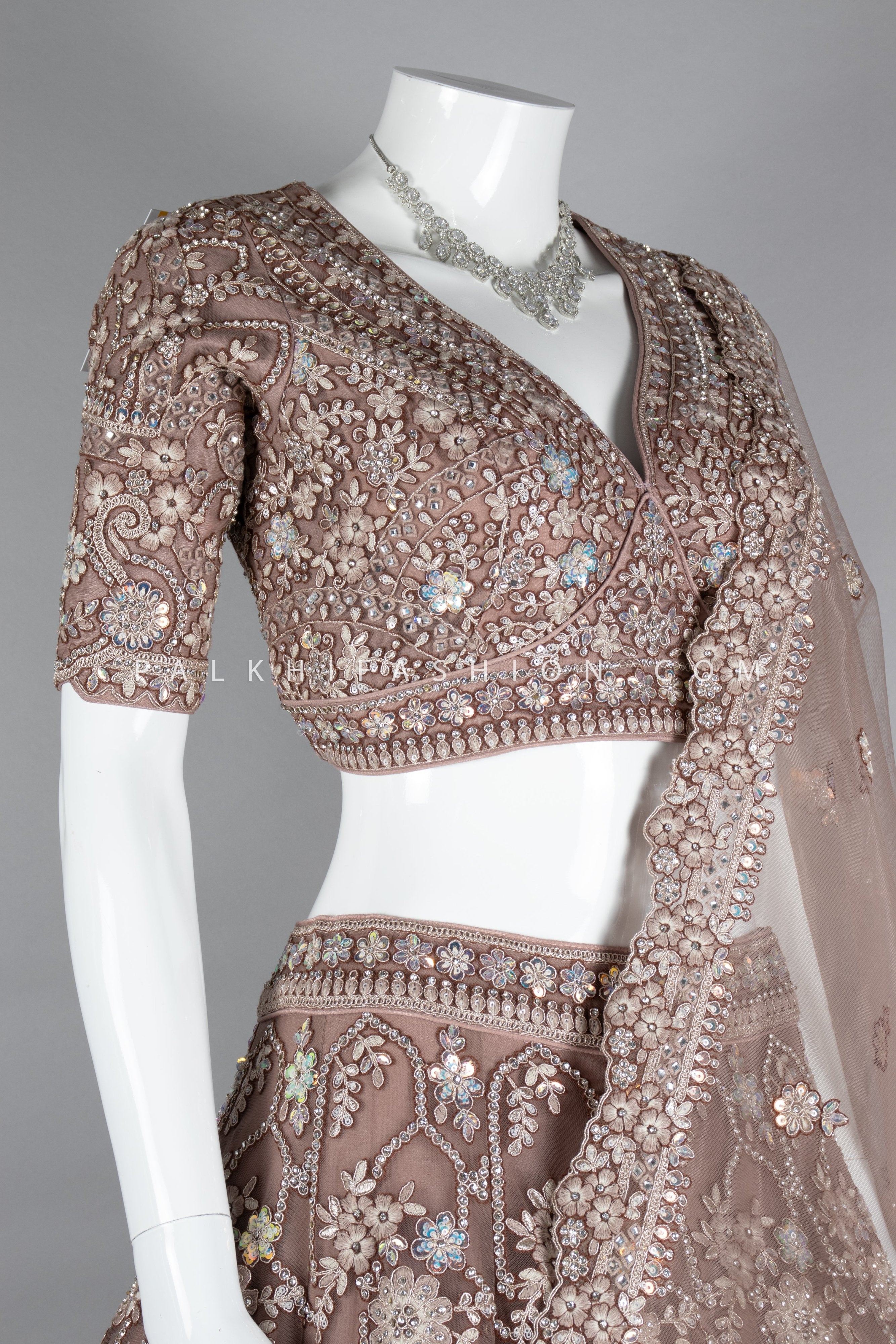 Graceful Grandeur: Soft Amber Lehenga Choli with Embroidery & Handwork