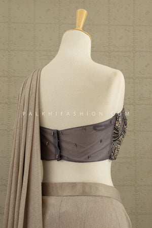 Luxe Mirage: Champagne Sculpted Saree with One - Shoulder Embellished Blouse