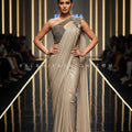 Luxe Mirage: Champagne Sculpted Saree with One - Shoulder Embellished Blouse