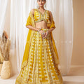 Sunlit Haldi Radiance: Mustard Yellow Bandhani Print Lehenga Set with Mirror Blouse – Palkhi Fashion Houston