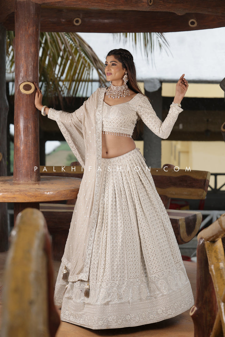 Magnetic Lakhanvi Work Designer Lehenga Choli In Off-white Color - Palkhi Fashion